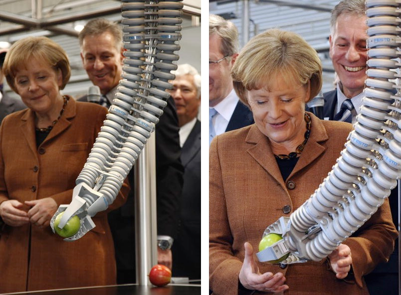 Illustration for article titled Why Is Angela Merkel Always Palling Around With Robots?